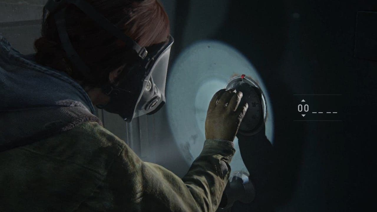 A close-up of a character's hands adjusting the combination dial on a safe in The Last of Us Part II.