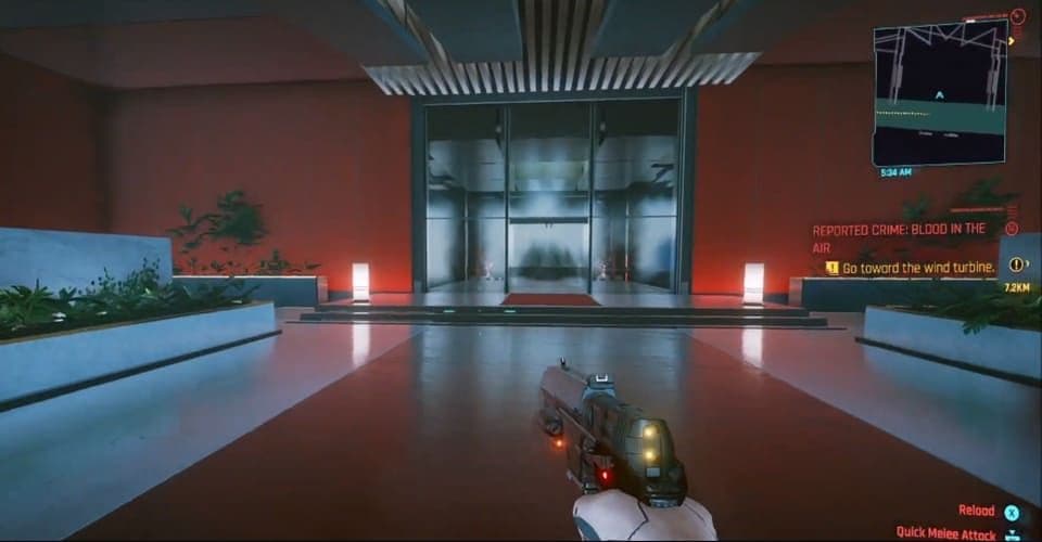 V outside Arasaka Tower's glass entrance with a weapon drawn