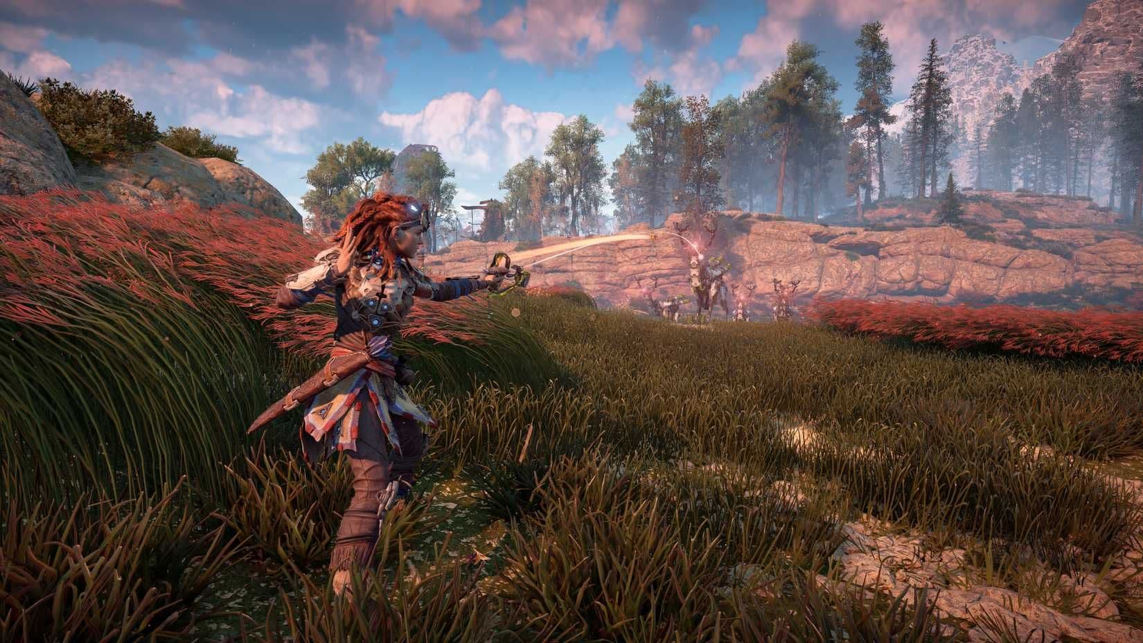Aloy uses a Blast Sling to attack a herd of Grazers in Horizon Zero Dawn.