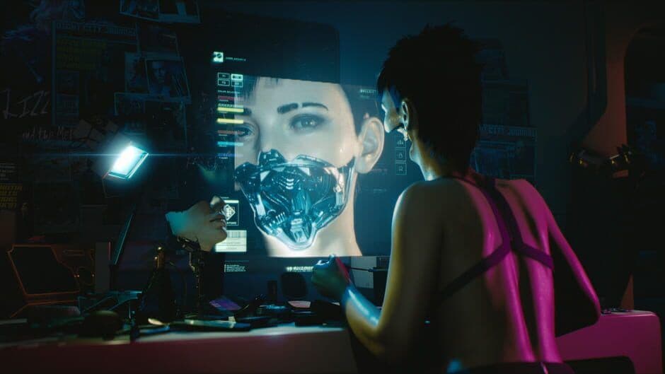 A holographic face and cyberware interface appear during a Cyberpunk 2077 presentation.