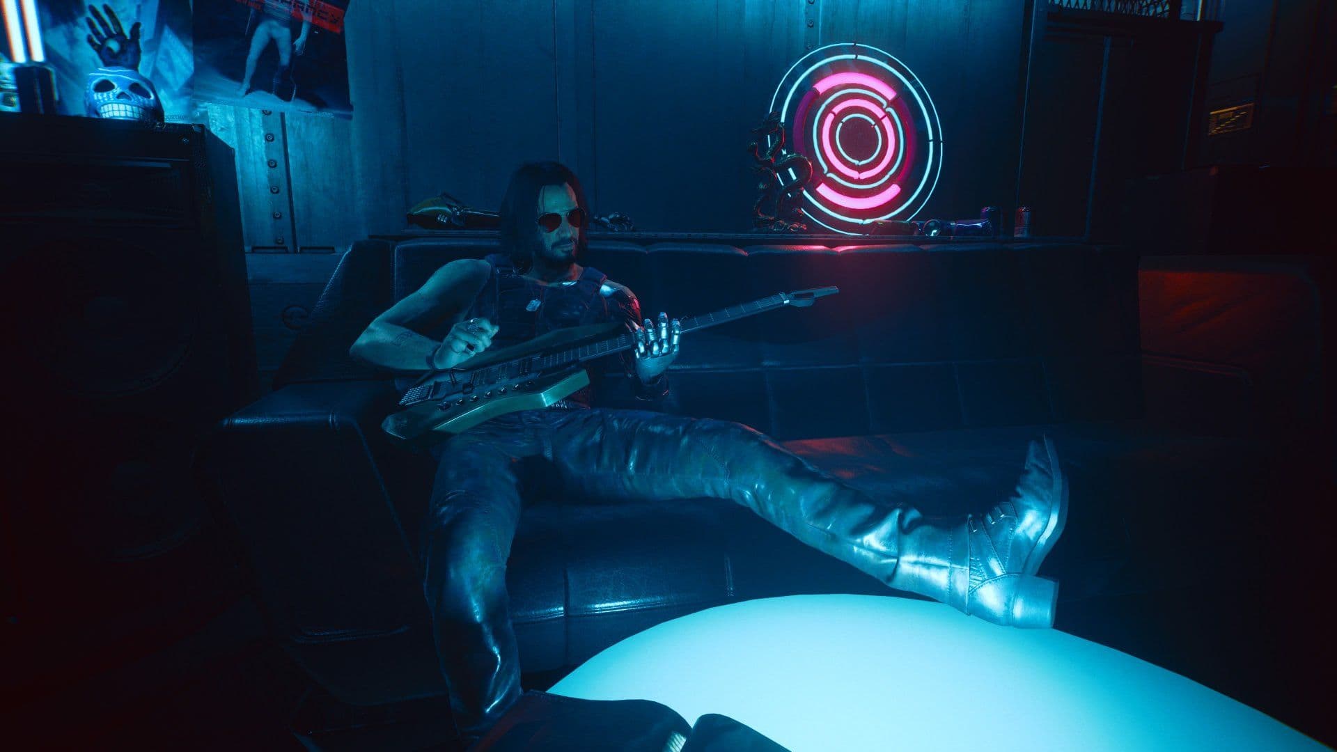 Johnny Silverhand sitting with his guitar in a neon-lit room in Cyberpunk 2077