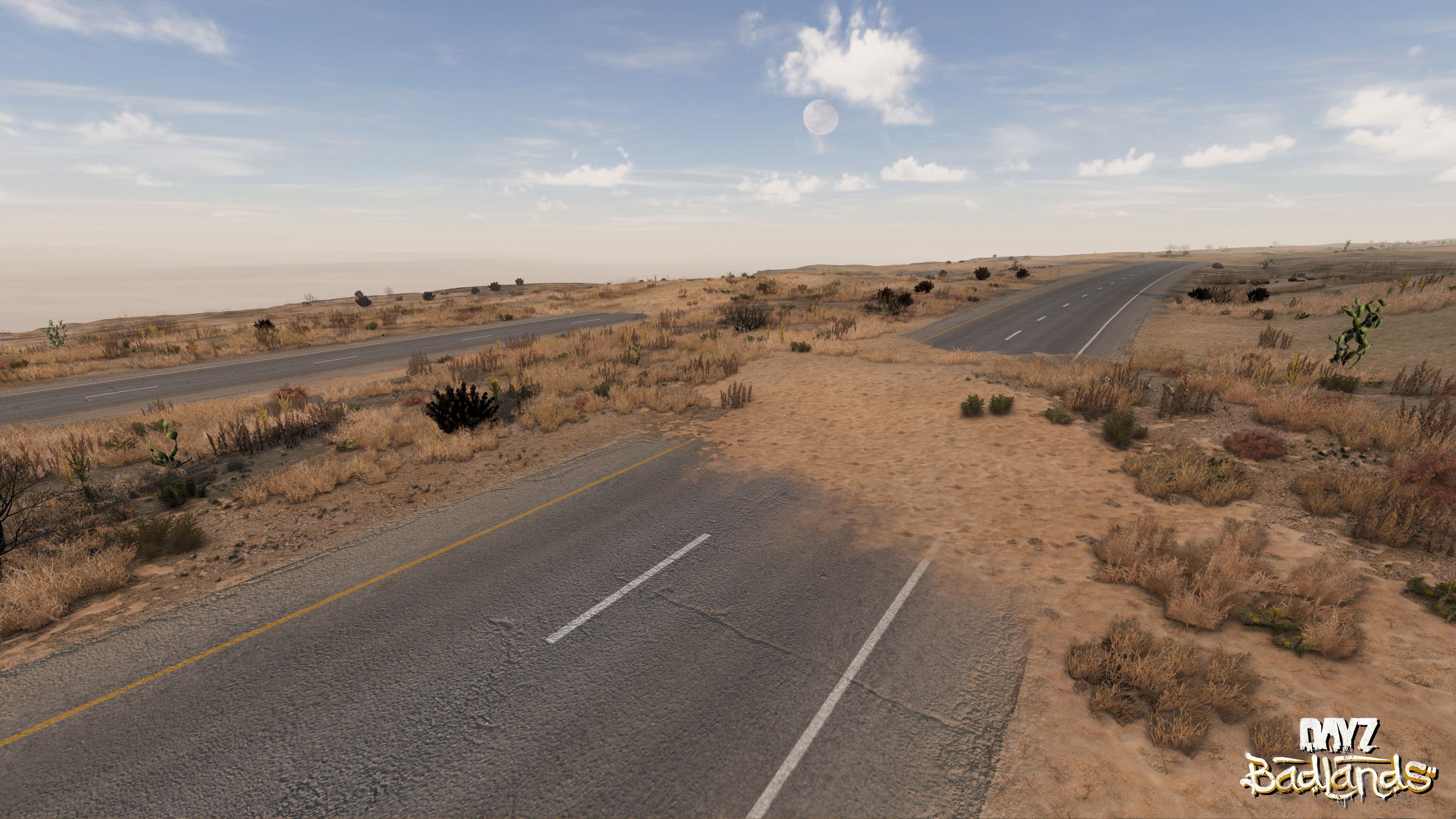 An empty highway running through dry scrub on Nasdara in DayZ Badlands