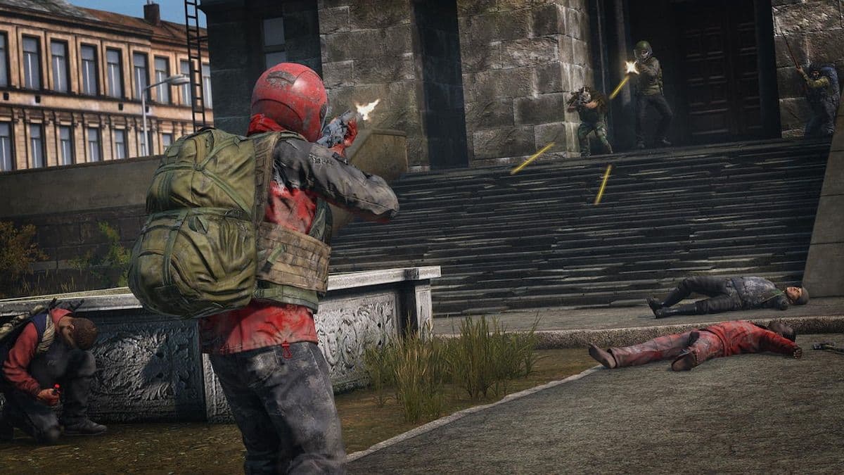 DayZ players exchange rifle fire on the steps of a city building in a deathmatch screenshot.