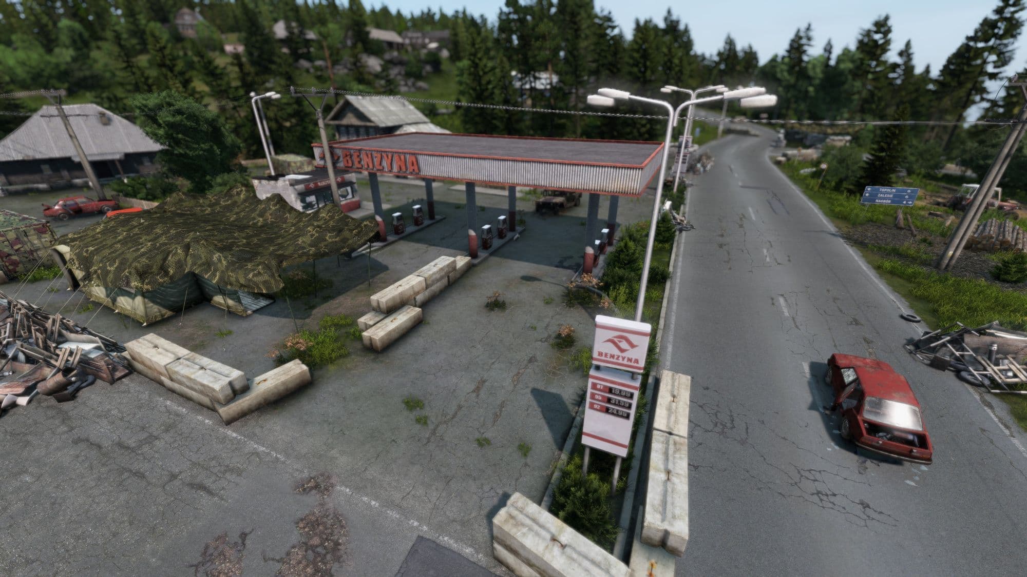 Polana fuel station beside a road with multiple DayZ pumps.