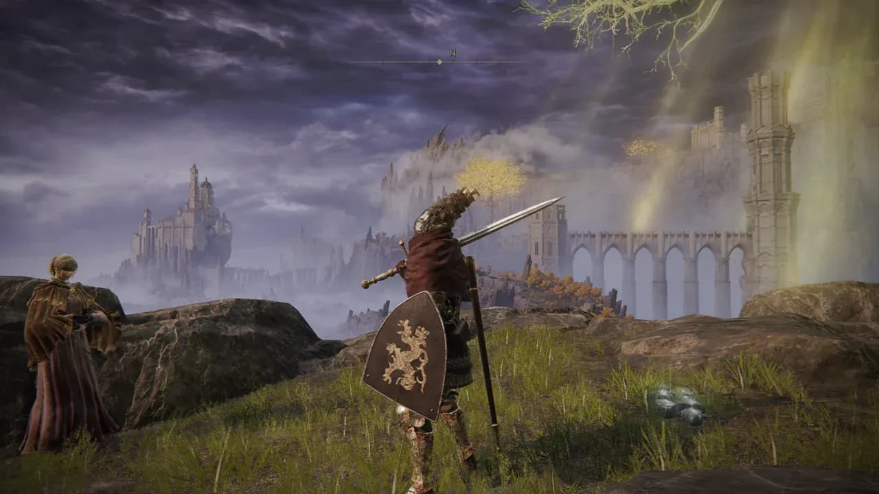 An armored warrior overlooks the vast, misty landscape and towering castles of Elden Ring's open world.