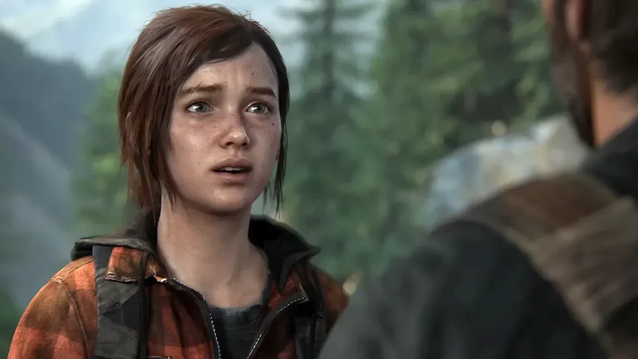 A distressed Ellie Williams faces another character against a blurred forest backdrop in The Last of Us Part II.