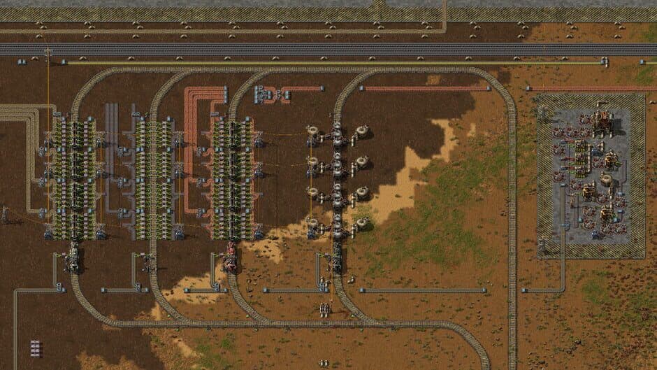 Automated turrets in Factorio provide a defensive perimeter against incoming waves of enemies.