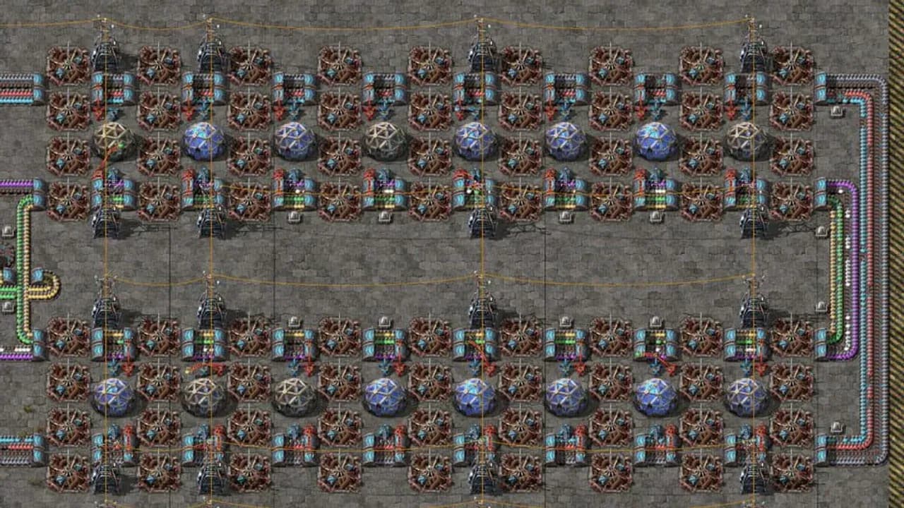 A sprawling late-game Factorio base showcasing intricate conveyor belt networks, assembly machines, and logistics.