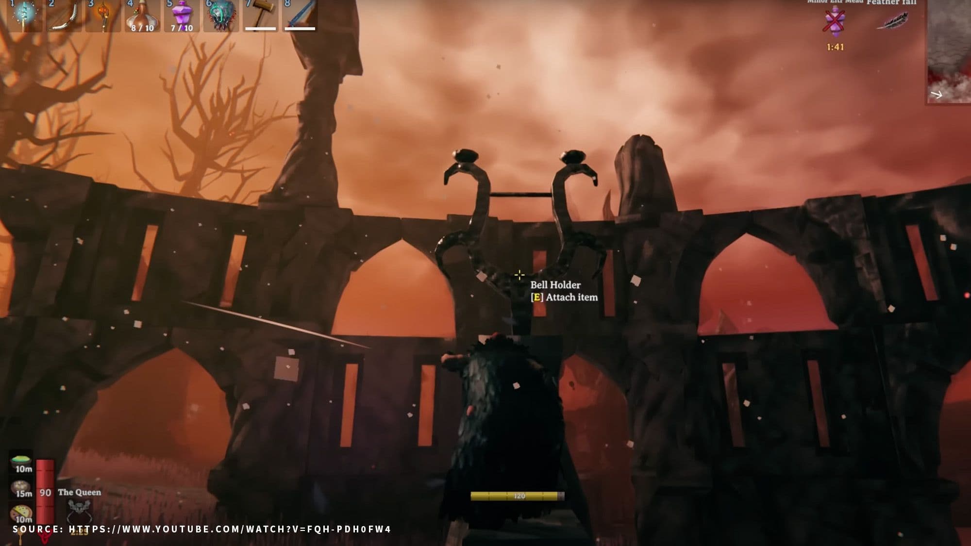 A Valheim player approaches a Bell Holder inside Fader’s Ashlands arena