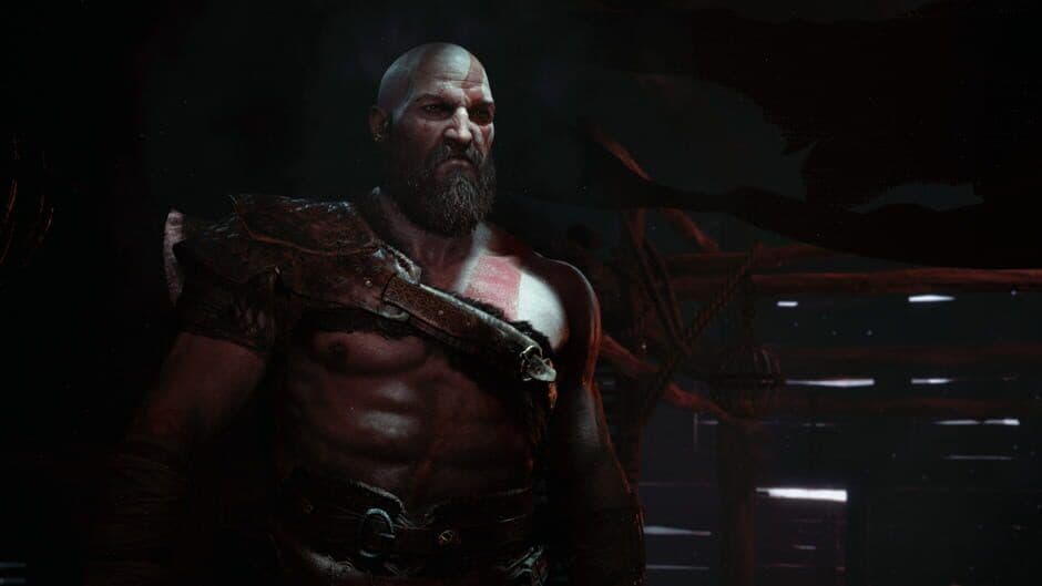Kratos stands in a snowy landscape in this official God of War gameplay screenshot.