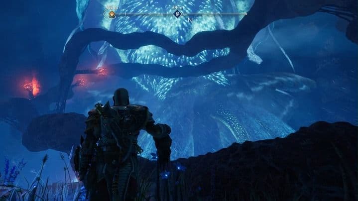 Una enorme criatura medusa voladora ilumina los cielos del desierto de Alfheim en God of War Ragnarök.