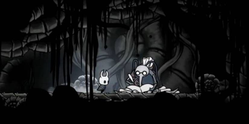 The Knight encounters Cornifer in the Ancient Basin area of Hollow Knight.