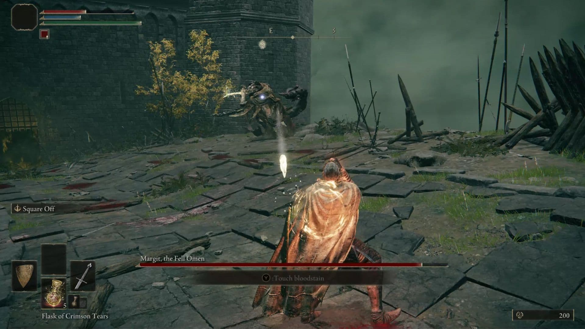 The boss fight against Margit the Fell Omen at the entrance to Stormveil Castle in Elden Ring.