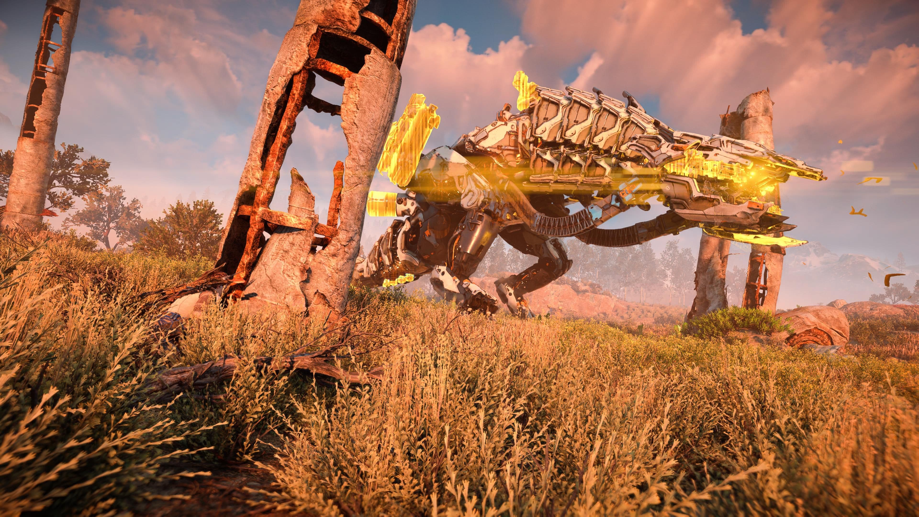 A mechanical Thunderjaw targeted near ruins in Horizon Zero Dawn to disable its disc launchers.