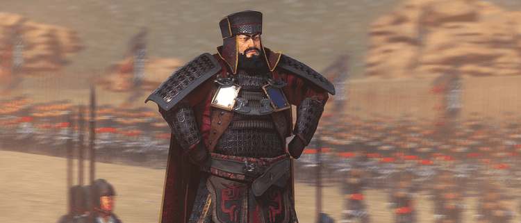 A commanding leader in Total War: Three Kingdoms overlooking a battlefield, representing faction legitimacy.