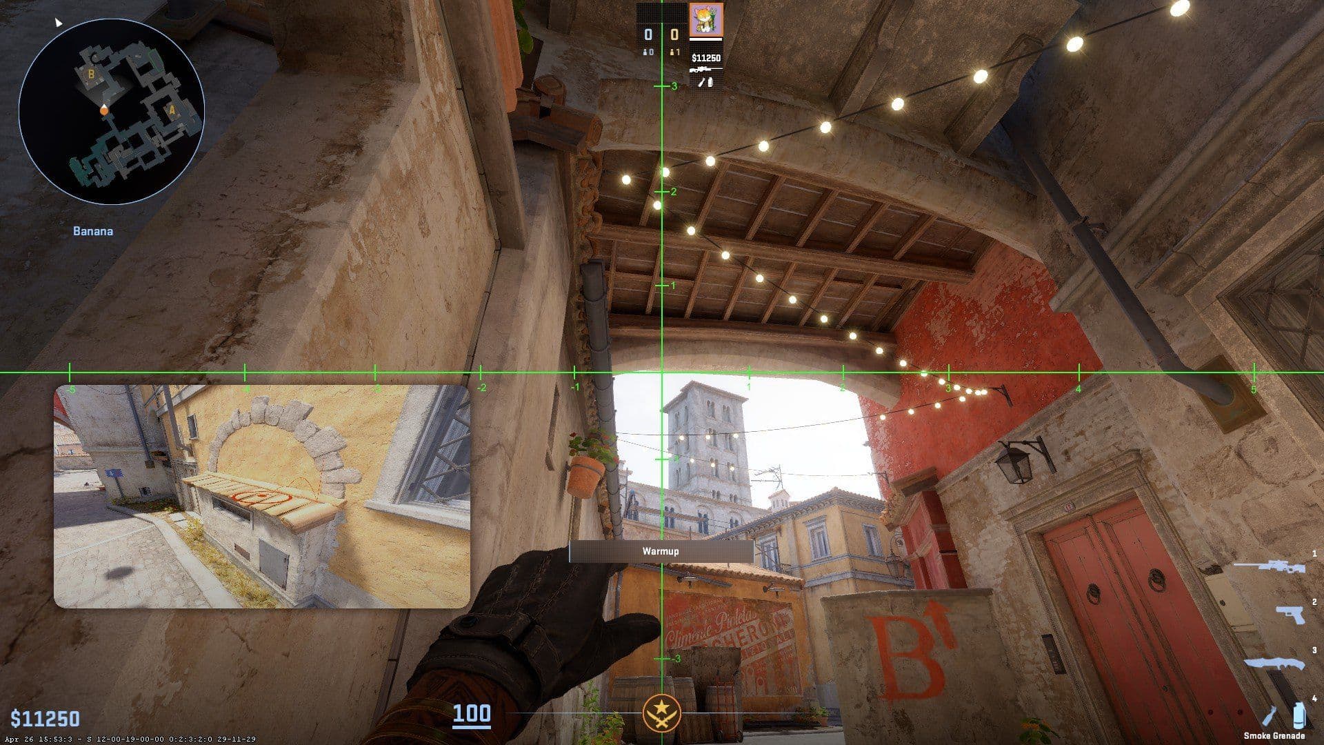 First-person perspective in Counter-Strike 2 showing a player holding an angle in a narrow alleyway.