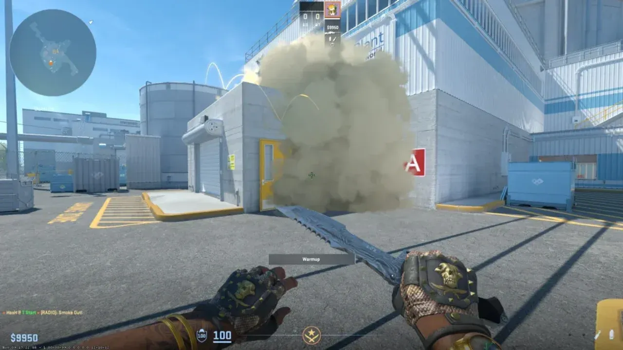 A Counter-Strike 2 player executes a smoke grenade throw to obscure a building entrance during a tactical match.