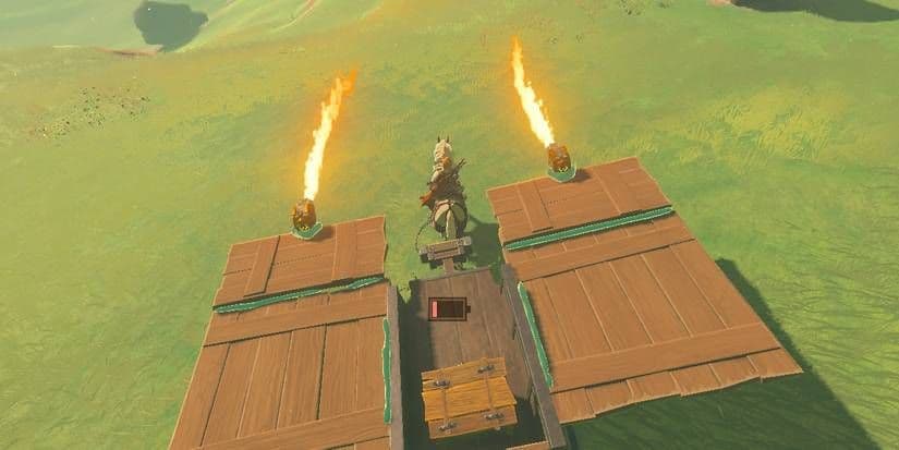 Link drives a custom vehicle with Zonai flamethrowers in The Legend of Zelda: Tears of the Kingdom.