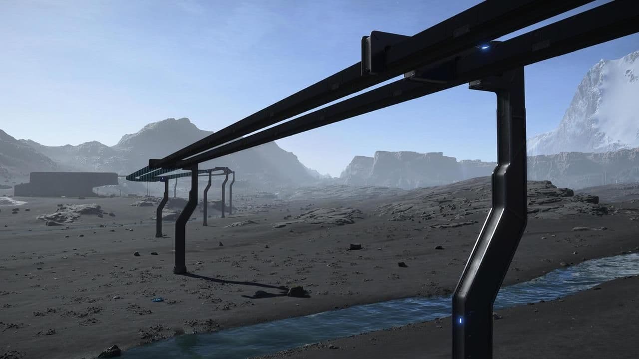 A monorail track stretches across a snowy mountain landscape in Death Stranding 2.