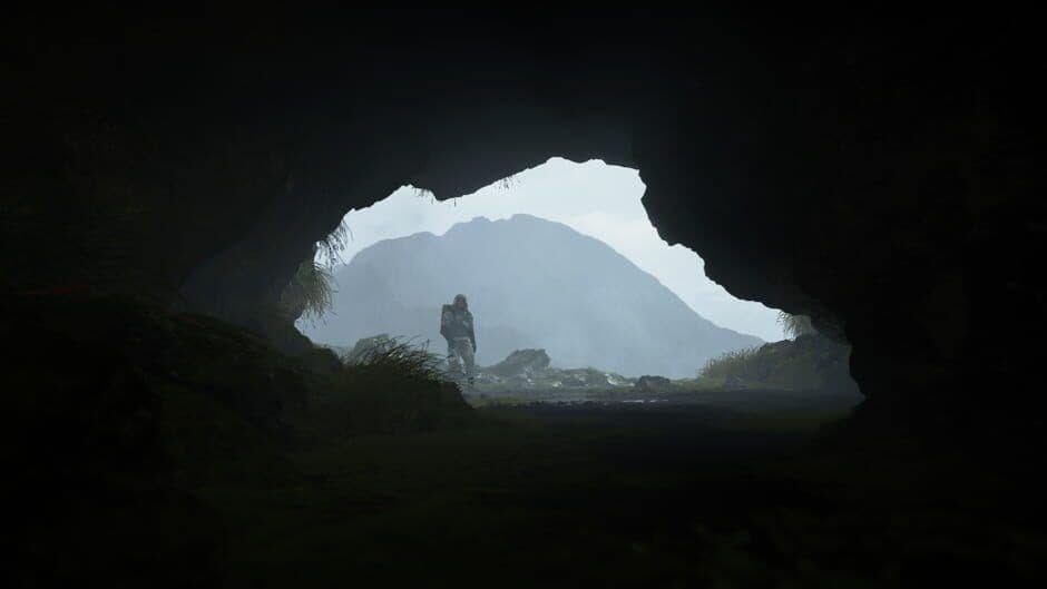 Death Stranding gameplay showing Sam Bridges in a rocky area.
