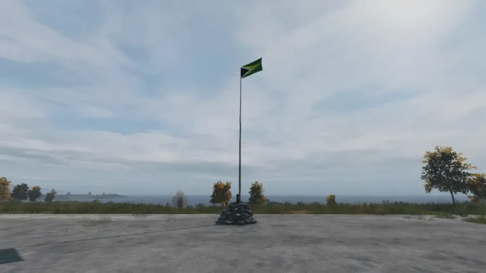 A completed DayZ flag pole on open ground with its flag fully raised at the top of the mast