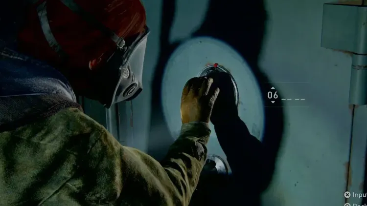 Ellie wearing a gas mask while entering a combination into a wall safe in The Last of Us Part II.