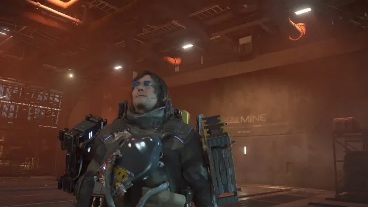 Sam Bridges stands inside a resource mine in Death Stranding 2 while farming for crafting materials.