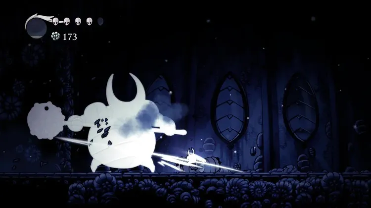 The Knight faces the massive False Knight boss in a dark arena during a Hollow Knight combat encounter.