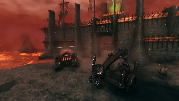 A fuelled Battering Ram and a Catapult parked outside the spiked outer wall of a Valheim Charred Fortress, with the green tower beam rising behind it