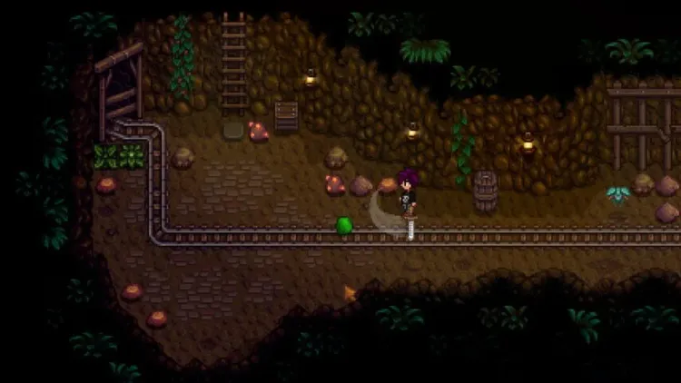 A player character explores a dark floor of the Stardew Valley Mines surrounded by rocks and glowing crystals.