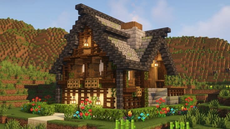 A small 3x3x3 wooden and stone starter shelter surrounded by flowers in a Minecraft world.