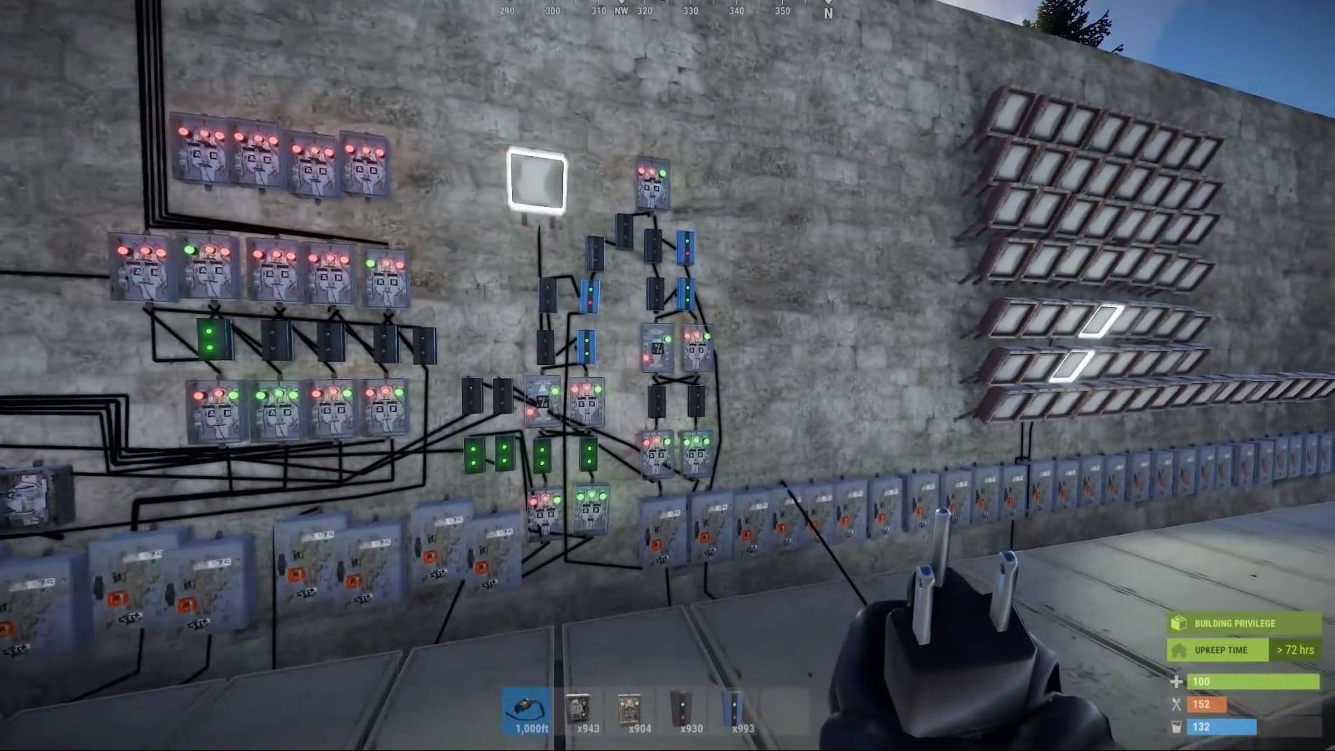 Rust player inspecting a wall-mounted electrical circuit with switches and lights