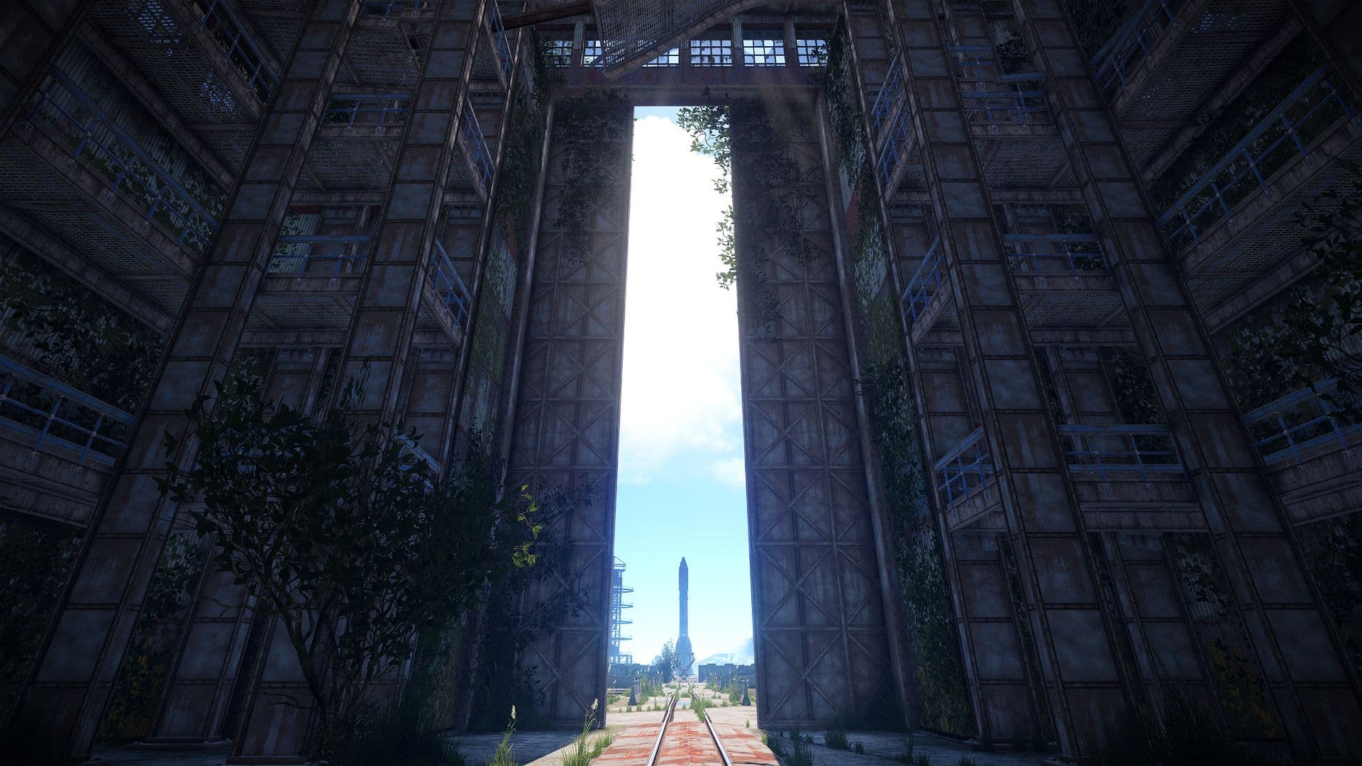 Rails lead from Rust’s abandoned rocket factory toward the Launch Site pad