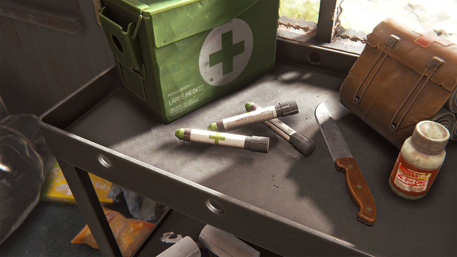 Medical Syringes, a Large Medkit case, and bandages on a Rust medical table