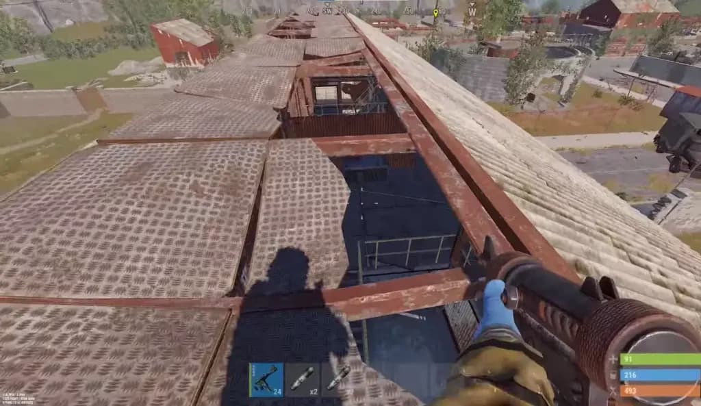 Rust player checking the Water Treatment Plant rooftops for ambushes