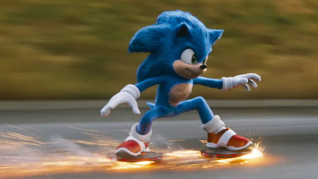 Sonic the Hedgehog skates at high speeds with sparks flying from his shoes against a blurred urban backdrop.