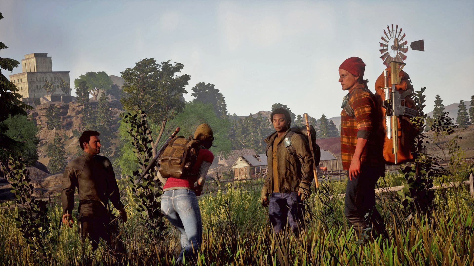 Un grupo de cuatro supervivientes permanecen juntos en State of Decay 3, destacando el enfoque cooperativo del juego.