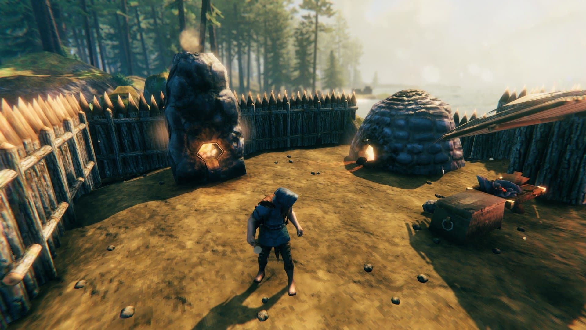 A Valheim charcoal kiln and smelter operating together in an early-game base