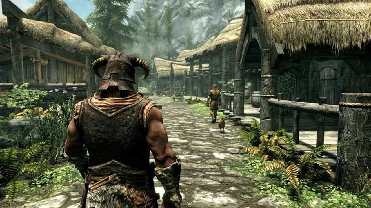 The iconic Dragonborn walks through a rustic village in The Elder Scrolls V: Skyrim with a companion and a dog.