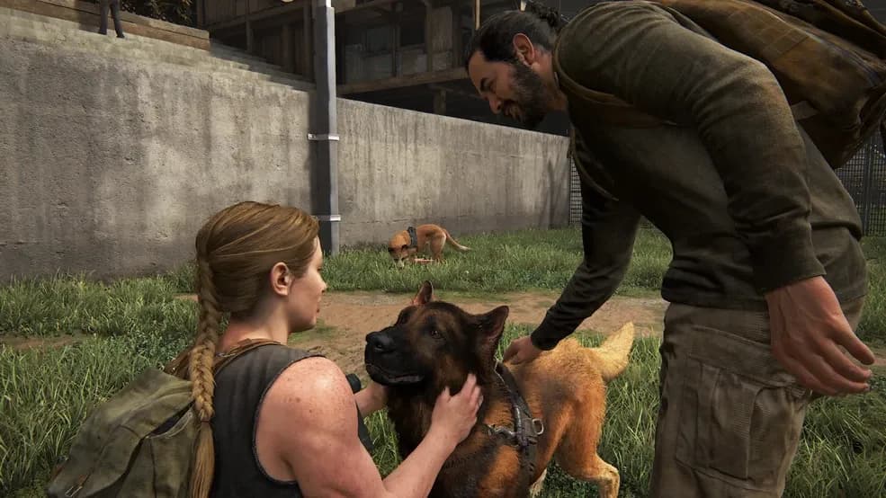 Abby Anderson interacts with dogs at the WLF base in The Last of Us Part II.