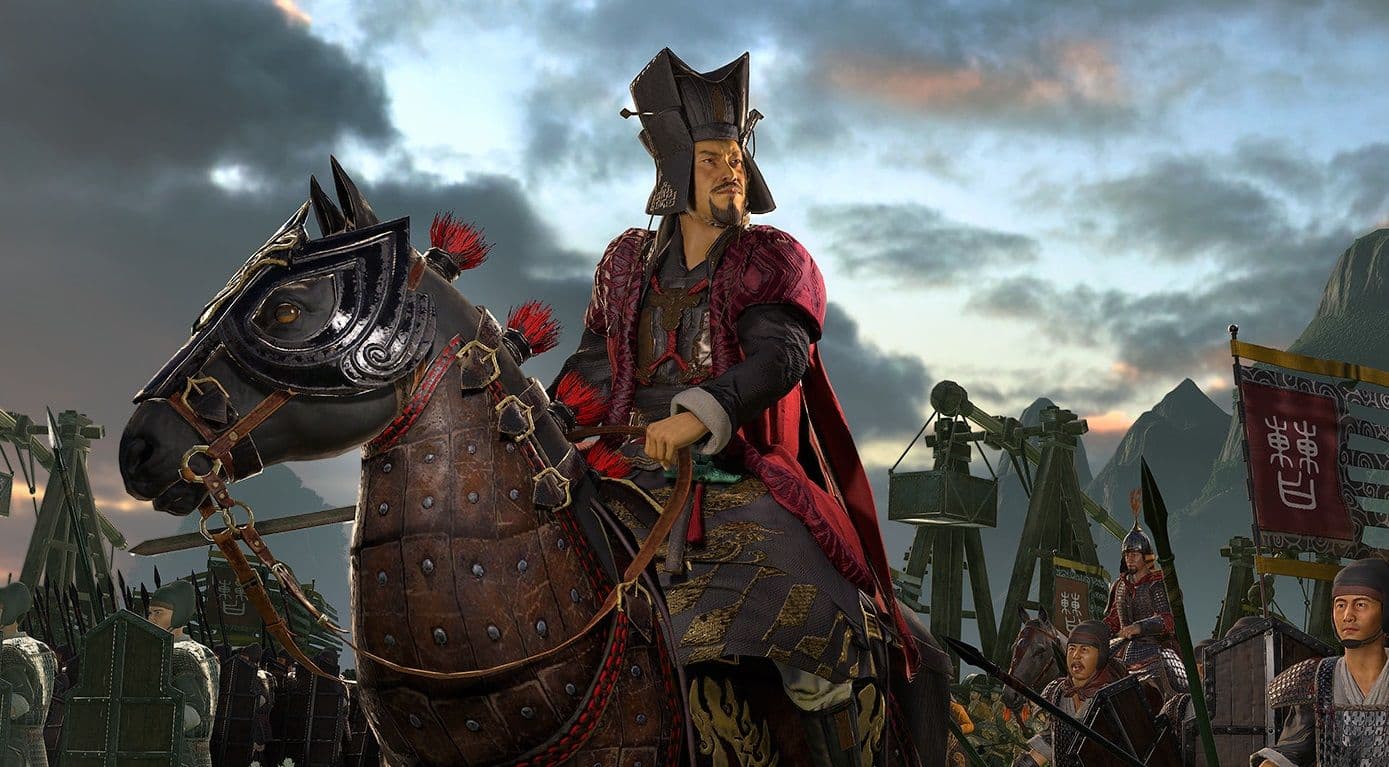 A Three Kingdoms warlord on horseback leading troops with banners into battle.