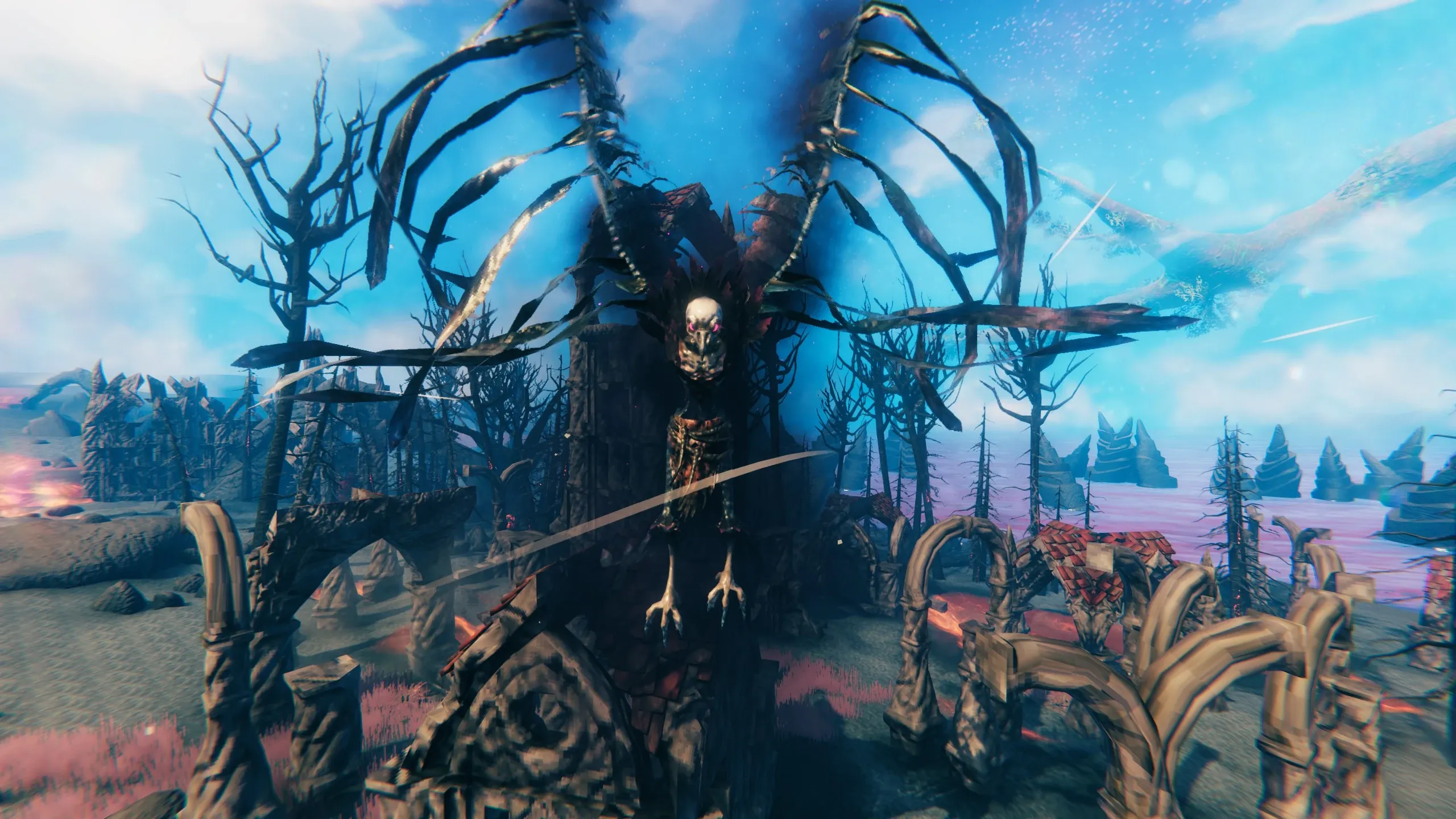A Fallen Valkyrie perched with wings spread among the charred trees of Valheim’s Ashlands