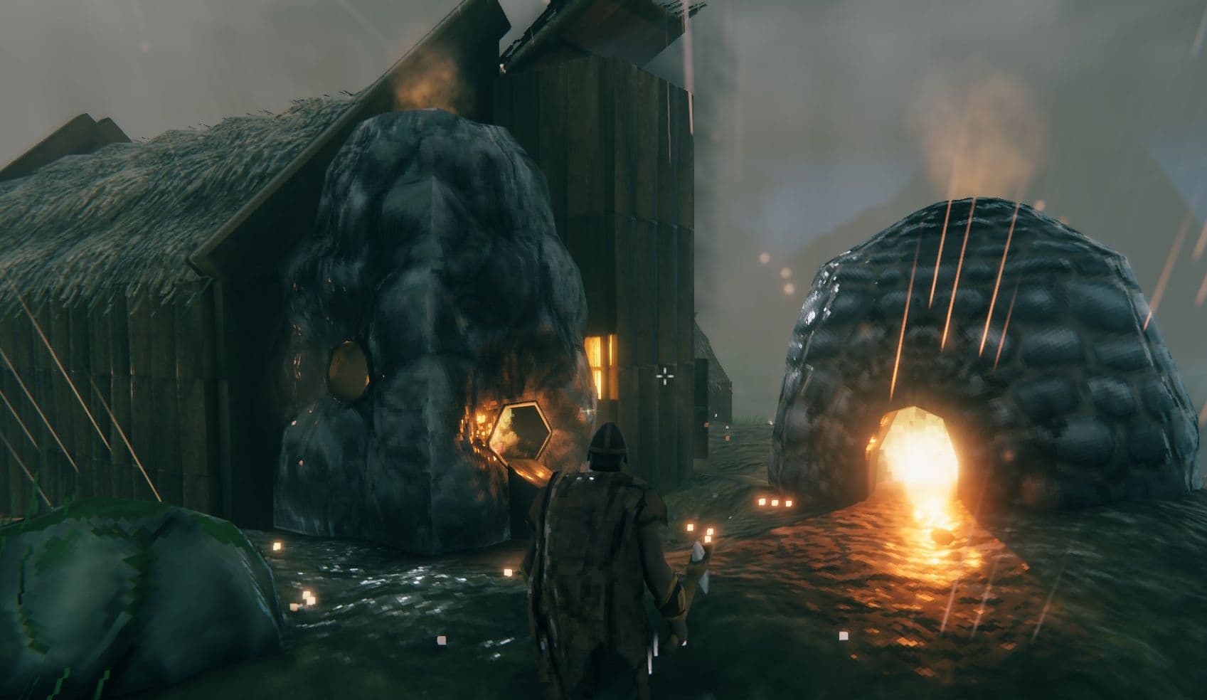 A Valheim player character interacts with a cooking station and building structures in a base.