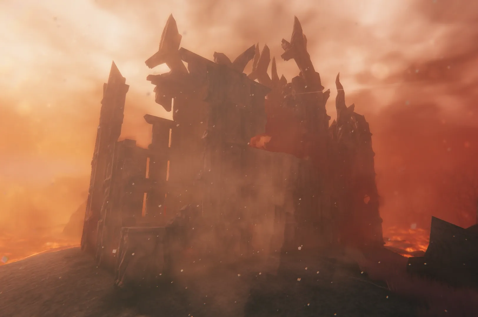 A tall Charred Ruins cathedral structure standing in ash and smoke in Valheim’s Ashlands