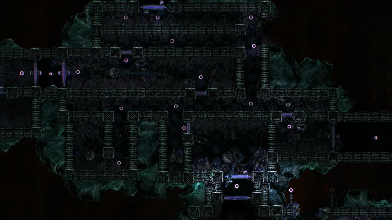 A whole alien ruin complex embedded in Europan rock in Barotrauma, its long corridors and blocky chambers built from teal chevron masonry and studded with pink light rings